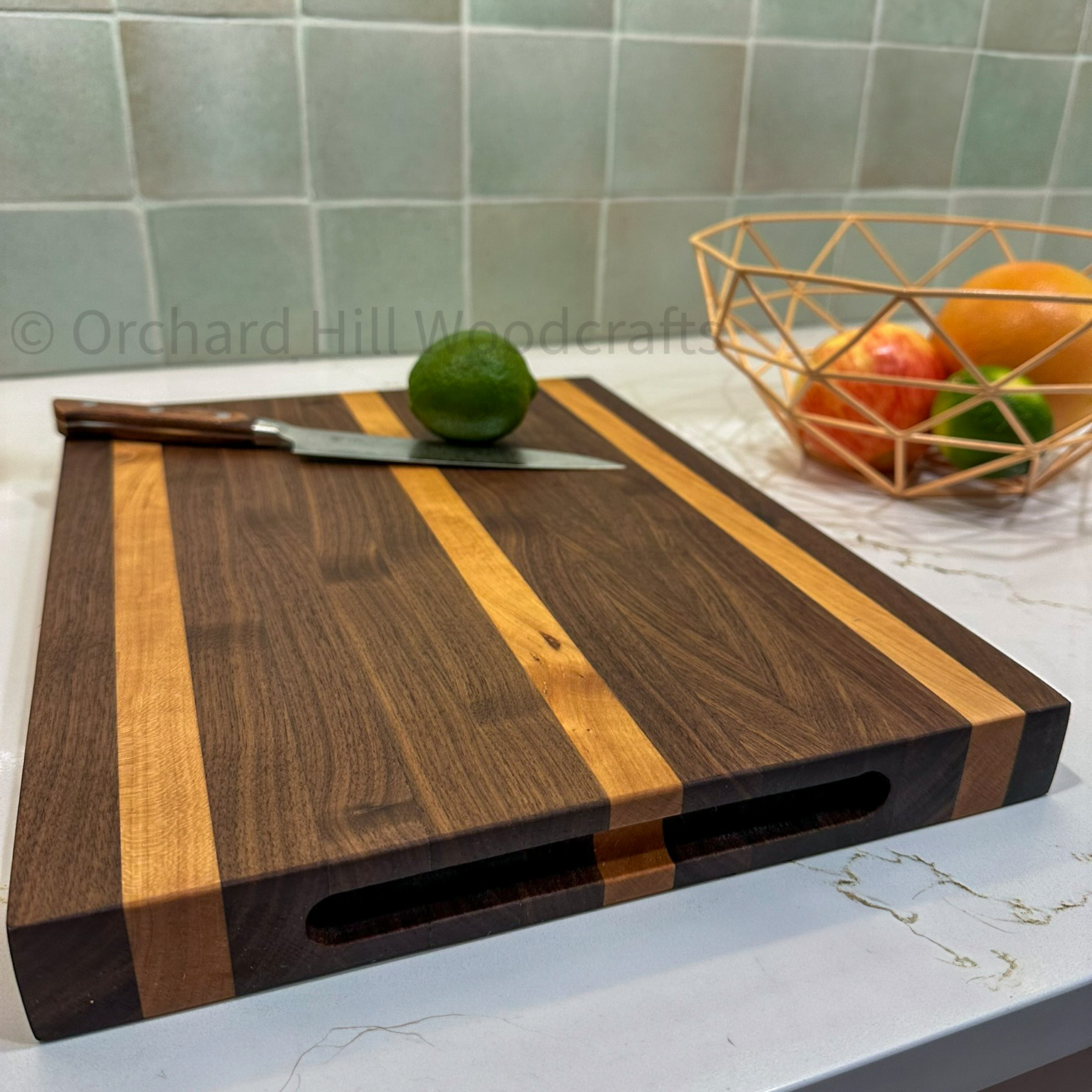 Walnut and cherry edge-grain cutting board in kitchen